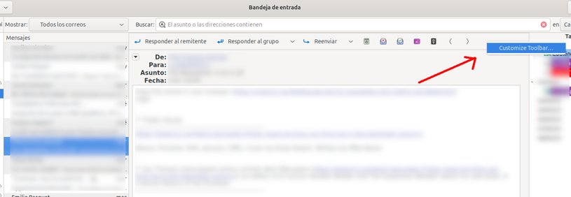 Captura de pantalla del cliente de correo electrónico Evolution. Una flecha señala la opción "customize toolbar", en la cabecera del mensaje.