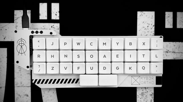 a ortholinear keyboard in white and cyberpunk optics