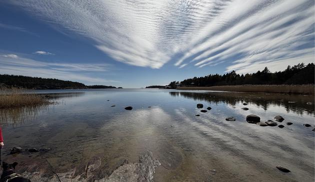 Picture of a calm bay with clouds reflecting in the water...