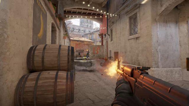 🕶️ An FPS view where the player - equipped with an automatic rifle, fires at his opponent (also firing at the player) located in a courtyard, at the end of a corridor, in a finely detailed urban environment.

📚️ Counter-Strike 2 (CS:GO 2) is a major technical upgrade to Counter-Strike: Global Offensive - the 4th game in the series, and an exclusively multiplayer online and team-based tactical FPS pitting counter-terrorists against terrorists. There's no storyline, just objectives to complete in different game modes (Competitive, Casual, Deathmatch, Arms Race, Demolition, Wingman, Retakes and Danger Zone). For example, the team may be tasked with securing a location, planting or defusing a bomb, or rescuing or capturing hostages. At the end of each round, players are rewarded for their individual and team performances.