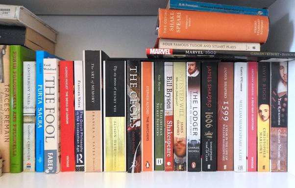 Shelf of books mostly about Shakespeare and late 15th century-early 16th century culture.