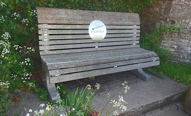 A bench, with a plaque featuring Acker's iconic bowler hat, his clarinet & "Acker Bilk 1929-2014".