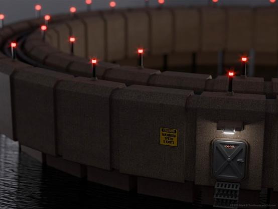 Concrete bastion set in a circle upon the water with and array of red lights around the top and a metal hatch entrance in the front lit from above with a sign to the side.