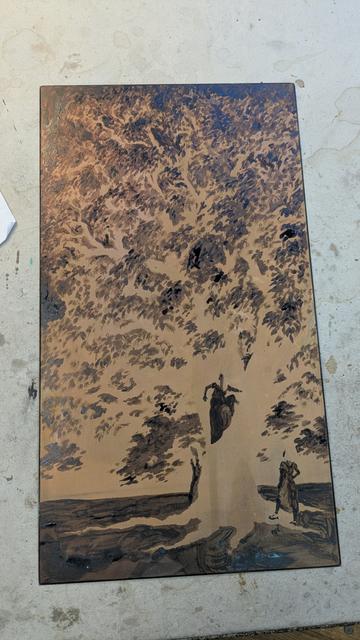 Photo of a copper plate partly covered with etching ground, showing the negative shape of a tall tree and three characters near its base.