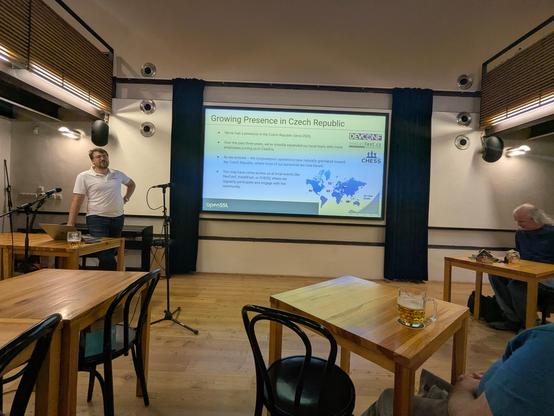A large screen with a slide from OpenSSL presentation.