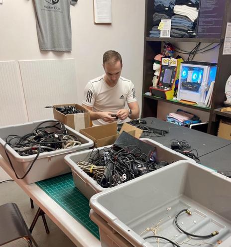 Picture of James sitting at the table and working on sorting.