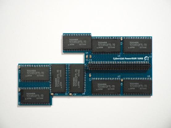 A photo of a printed circuit board containing 20 RAM chips (9 visible), labeled Cyberslak PowerRAM 10MB.