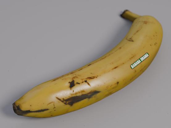 a model of a yellow banana with a label saying "Banana Drama"