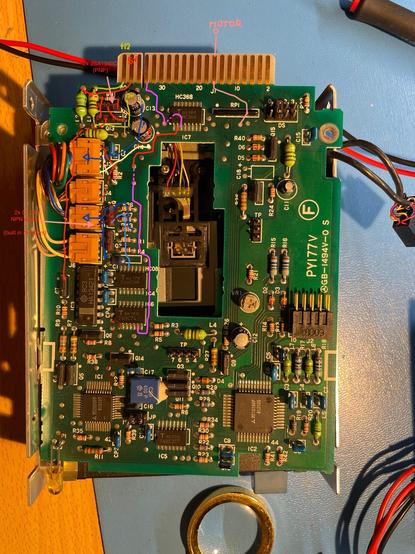 A picture of the main PCB of an Alps 720KB disk drive. A drawing of the path of certain signals is superimposed on the picture.