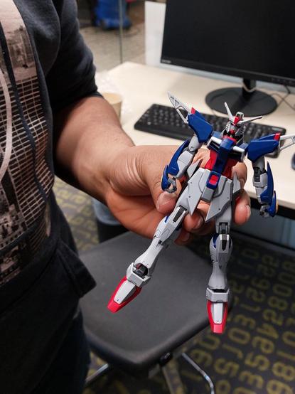 The shyest kid in the group had been working on their Power Ranger. 

I will admit it's not really a Power Ranger but I keep on forgetting this stuff because it's humanoid robots from Japan swords and guns and they're made by Bandai. I'm a bad teacher because I'm not interested is why I forget.