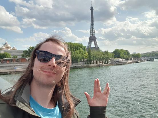 Me in Paris in front of the Seine and Eiffel Tower