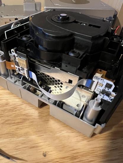 FlippyDrive modchip and ethernet adapter chip shown connected with a ribbon cable