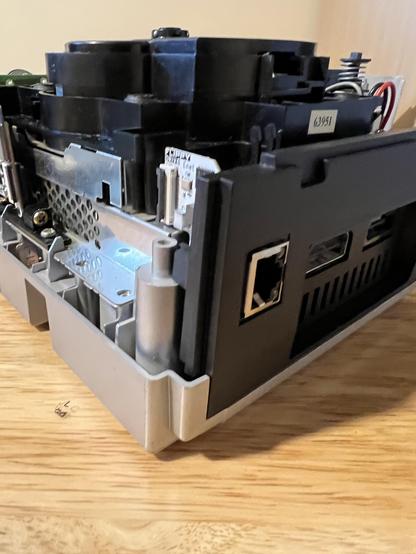 FlippyDrive backplate for GameCube with the FlippyDrive ethernet adapter and socket showing in the proper orientation