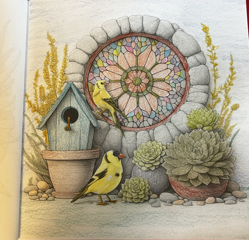 Two yellow chickadees in front of a stained glass window