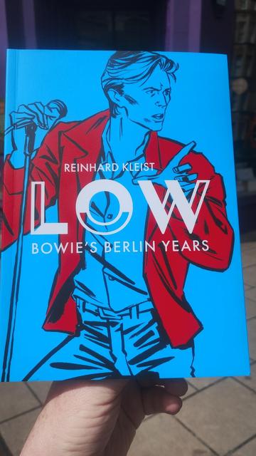 Cover for Low, a graphic memoir of David Bowie's Berlin years, by Reinhard Kleist, depicting the singer against a blue background