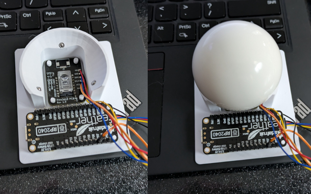 Left: A trackball testbed, showing the optical sensor, a microcontroller, and a cradle for the trackball with 3 embedded ball bearings
Right: The same testbed with the trackball in place