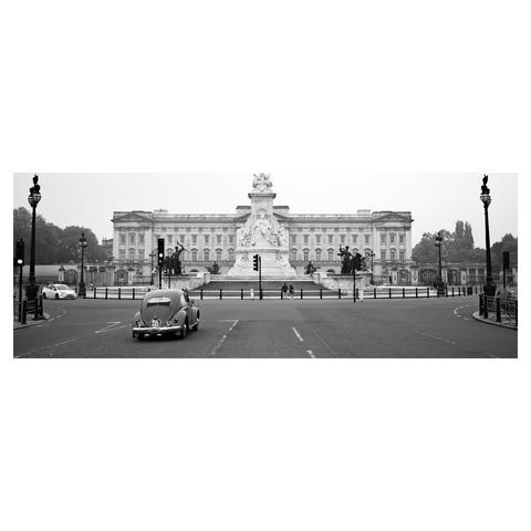 A VW beetle by a traffic light in front of Buckingham Palace in an early morning in London.