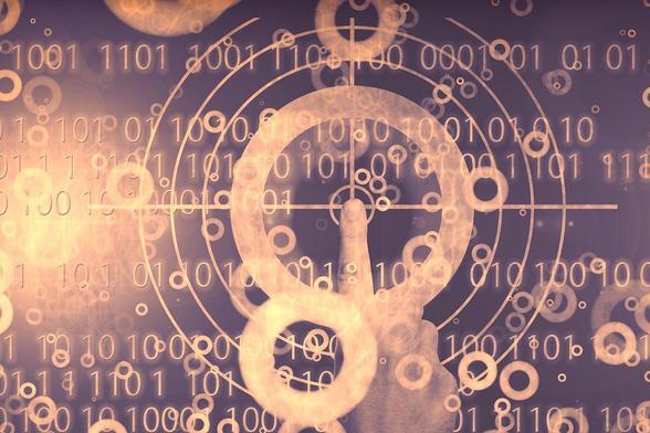 Das Bild zeigt eine abstrakte Darstellung von digitalen Elementen, darunter Binärcode (Einsen und Nullen), konzentrische Kreise und ein Fadenkreuz, die einen technologischen oder futuristischen Hintergrund bilden. Im Vordergrund ist eine Hand zu sehen, die auf einen der Kreise zeigt, was auf Interaktivität oder Auswahl hindeuten könnte.