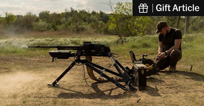 Yurii Klontsak, a Ukrainian reservist, demonstrating how to use Wolly, an automated machine gun.