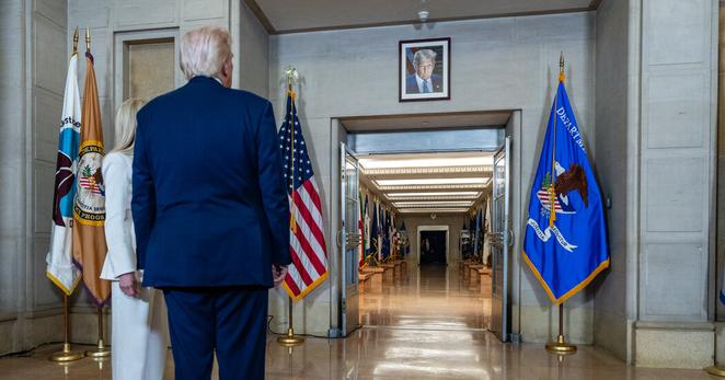 President Trump paused to view his official portrait hanging in the hallway at the Department of Justice last Friday.