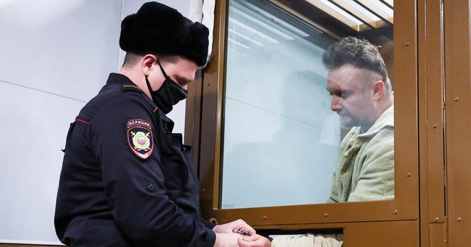 Andrei Kotov, right, at a hearing at Golovinsky District Court in Moscow in December, in a photo released by Russian state media.