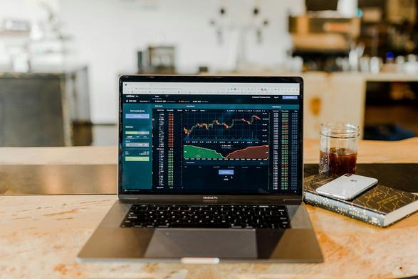 Price and depth chart on laptop (Austin Distel/Unsplash)