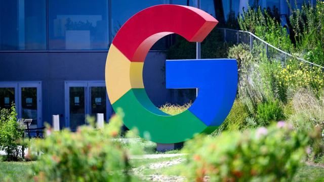 A large Google logo in the shape of a multi-colored G is seen outside Google's Mountain View offices.