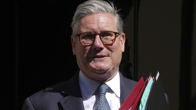 Britain's Prime Minister Keir Starmer leaves 10 Downing Street to attend the weekly Prime Ministers' Questions session in parliament in London, Wednesday, April 30, 2025. (AP Photo/Kin Cheung)