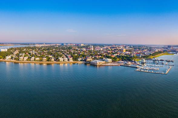 An aerial view of an island with homes and a harbor.