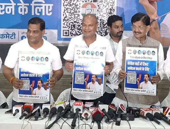 State Congress President Rajesh Ram launching a poster containing a QR code for the digital application form during a press conference.