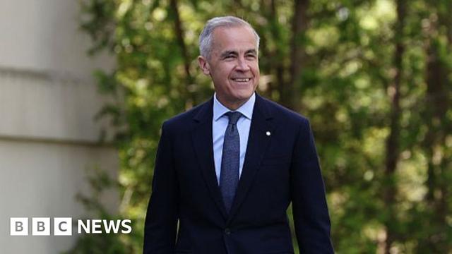 Mark Carney, Canada's prime minister, wearing a dark blue suit and tie and smiling broadly, arrives for a swearing-in ceremony at Rideau Hall in Ottawa, Canada