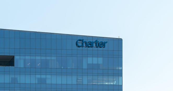 The Charter Communications headquarters in Stamford, Conn. The company said its deal with Cox Communications would help them compete against big rivals.