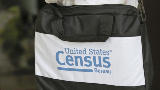 A census taker carries a briefcase as she knocks on the door of a residence in Winter Park, Fla., Aug. 11, 2020. (AP Photo/John Raoux, File) A census taker carries a briefcase as she knocks on the door of a residence in Winter Park, Fla., Aug. 11, 2020. (AP Photo/John Raoux, File)