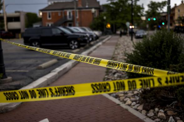 Police cordon off Pearl Street on June 1, 2025, in Boulder, Colorado, after a suspect reportedly threw an incendiary device at a group participating in an organized walk in solidarity with Israeli hostages in Gaza.