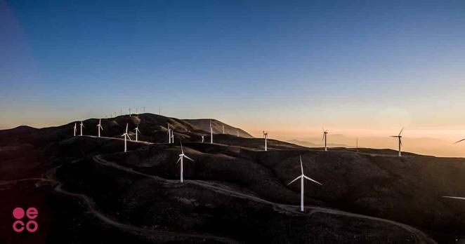 Many windmills on the top of low hills