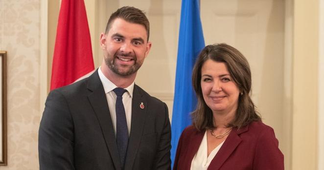 Alberta Premier Danielle Smith and former Minister of Mental Health and Addiction Dan Williams stand together during the swearing in of her cabinet, in Edmonton, Friday, June 9, 2023. THE CANADIAN PRESS/Jason Franson.