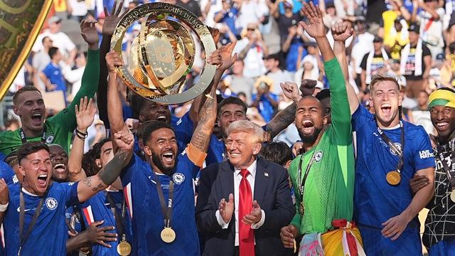 Donald Trump celebrates with Chelsea players after their Fifa Club World Cup victory