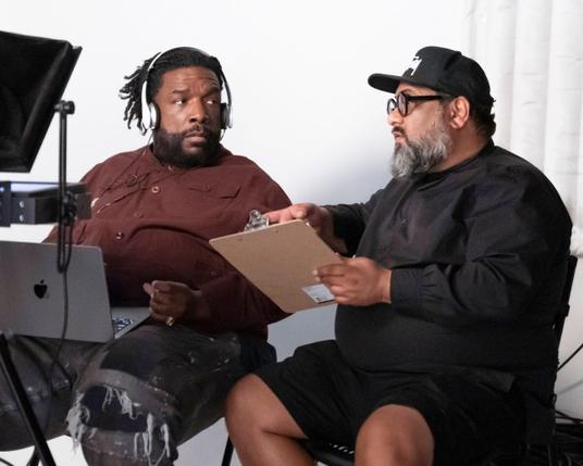 SLY LIVES! (AKA THE BURDEN OF BLACK GENIUS), from left: director Ahmir Questlove' Thompson, producer Joseph Patel, on set, 2025. ph: Kelsey McNeal / © Hulu / Courtesy Everett Collection