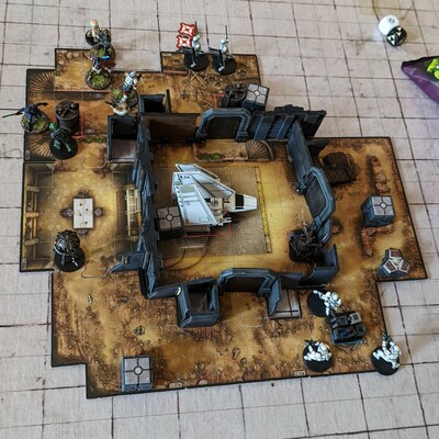 The board / miniatures game Imperial Assault being played.