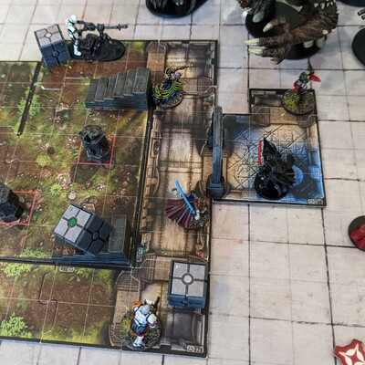 The board / miniatures game Imperial Assault being played.