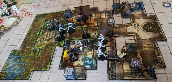 The board / miniatures game Imperial Assault being played.
