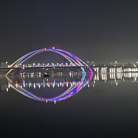 New I-74 bridge lights at night, looking down river from Illinois side