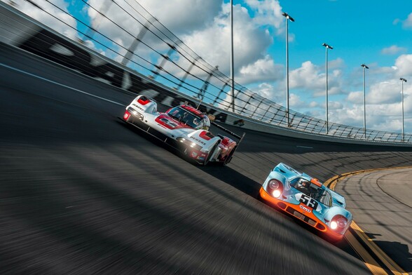 Gulf Oil liveried Porsche 917 and Porsche 963 photographed side by side on the banking at Daytona Speedway