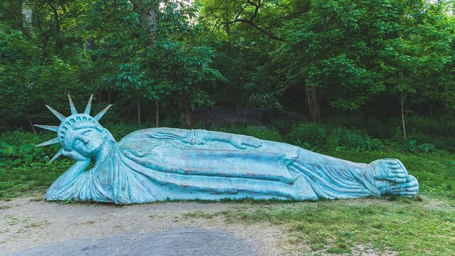 Photo of a 25-foot-long sculpture of a reclining Statue of Liberty installed in Morningside Park. The artwork as a mashup of the Statue of Liberty and the giant reclining Buddha statues found in Asia. Viewers were allowed to touch, climb and sit atop of the statue, which was coated with plaster resin and finished with copper paint and oxidizing acid, mimicking the look of the real-life Lady Liberty.

Harlem, NYC (2021)