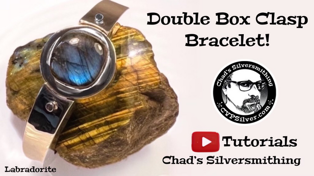 Pretty blue labradorite in a hollow form bracelet with a double clasp. 