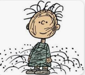 Pigpen from Charlie Brown. Wearing a green outfit, strands of hair sticking up, black dots and lines indicating dirt.