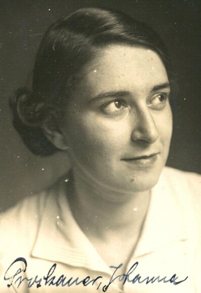 A portrait of a woman looking up right.