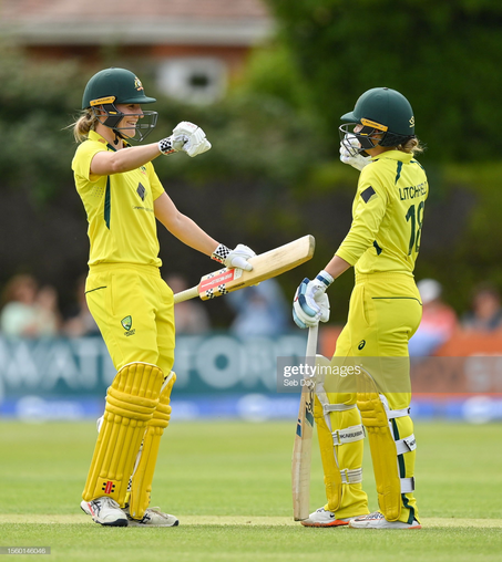 Dublin , Ireland - 28 July 2023; Phoebe Litchfield of Australia, right, is congratulated by teammate Annabel Sutherland after bringing up her century of runs during match three of the Certa Women's One Day International Challenge series between Ireland and Australia at Castle Avenue Cricket Ground in Dublin. (Photo By Seb Daly/Sportsfile via Getty Images)
