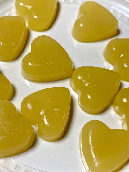 A pic of yellow jelly hearts on a white plate arranged artfully haphazard. They were made with just physalis juice, a pinch of sugar and agar agar. 

The juice from ripe berries is bright yellow and can make fancy broths, etc. I grow these and use them instead of tomatoes bc the long summer heat is too much to grow tomatoes. These physalis also don’t get hornworm or aphids like tomatoes do. Just some stippling from plant hoppers. 

When you heat the berries, they lose their sweetness and become very savory and taste exactly like tomatoes with a bright clean finish. 