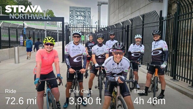 Group photo of the team at the GWB bike path entrance NJ side. Most wear the black and white #ColavitaNYCRaceTeam jersey 